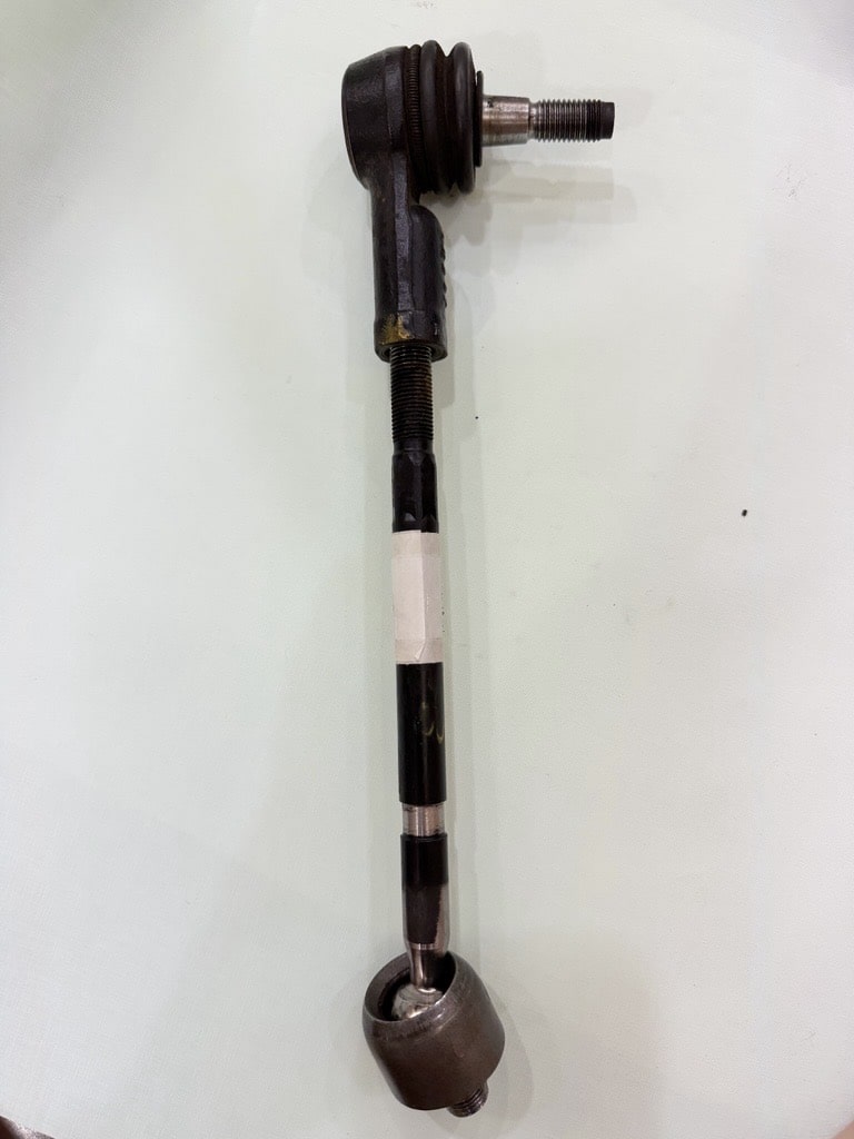 The original 1970 Ford Mustang Rack End sample received from the client, showing severe wear and a failing, loose housing connection.