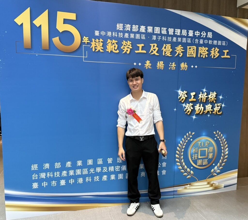 Great Auto Parts model worker Mr. Nguyen photographed at the ceremony display board.