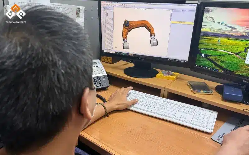 Great Auto Parts' engineer reviewing a control arm SolidWorks drawing to verify pivot geometry